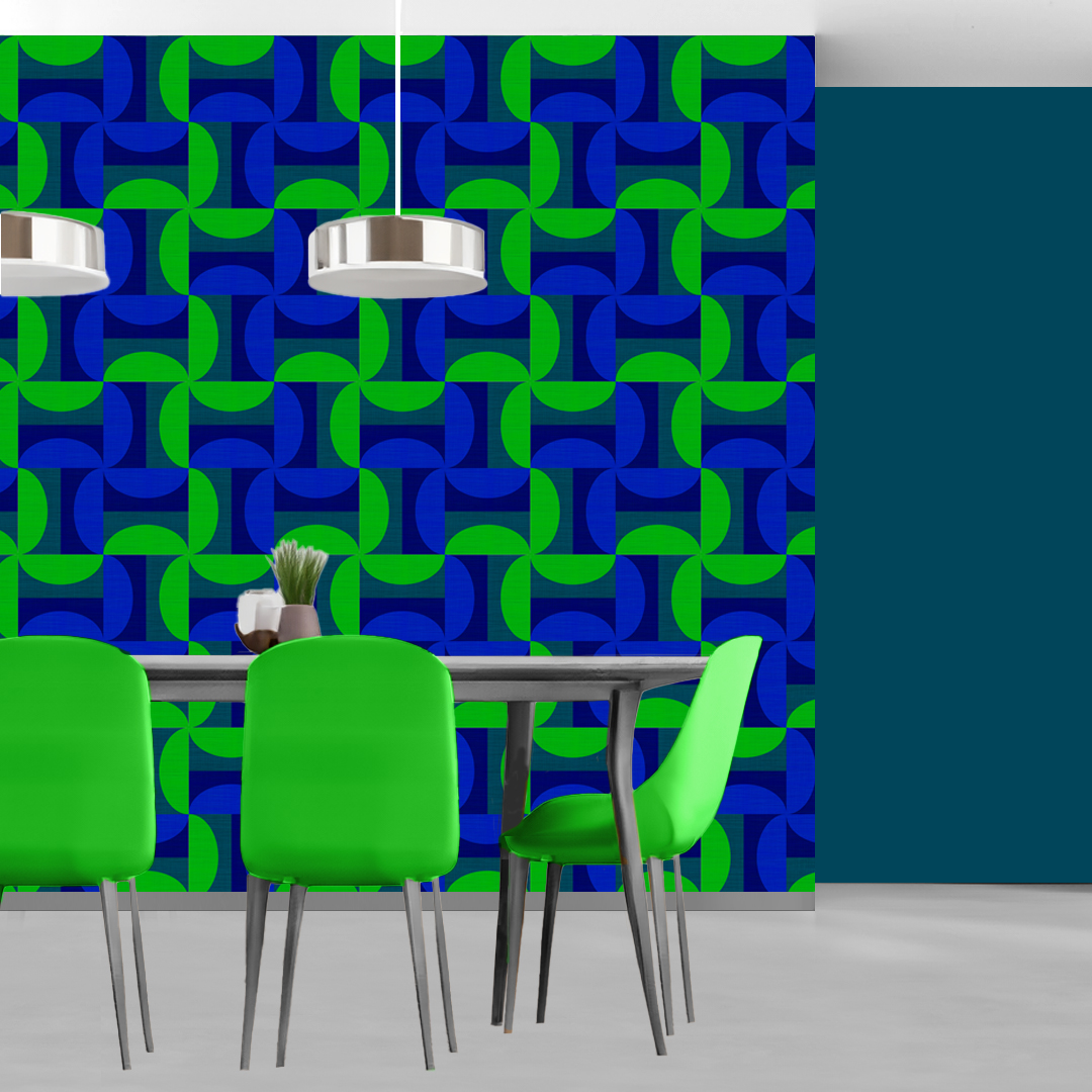 The artwork features a repeating geometric pattern of symmetrical shapes resembling elongated, curved diamonds or petals in various shades of blue and green. Each shape is split vertically with one half filled with a light blue and the other half filled with green or darker blue. The background is a light, almost pastel blue, which provides a soft yet vibrant backdrop. One of the blue shapes near the upper left contains a white starburst element, adding a focal point of brightness to the composition. The overall design conveys a modern, mid-century aesthetic with clean lines and harmonious color contrasts.